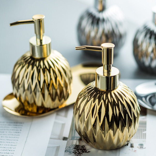 Rund design sæbedispenser i guld