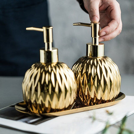 Rund design sæbedispenser i guld